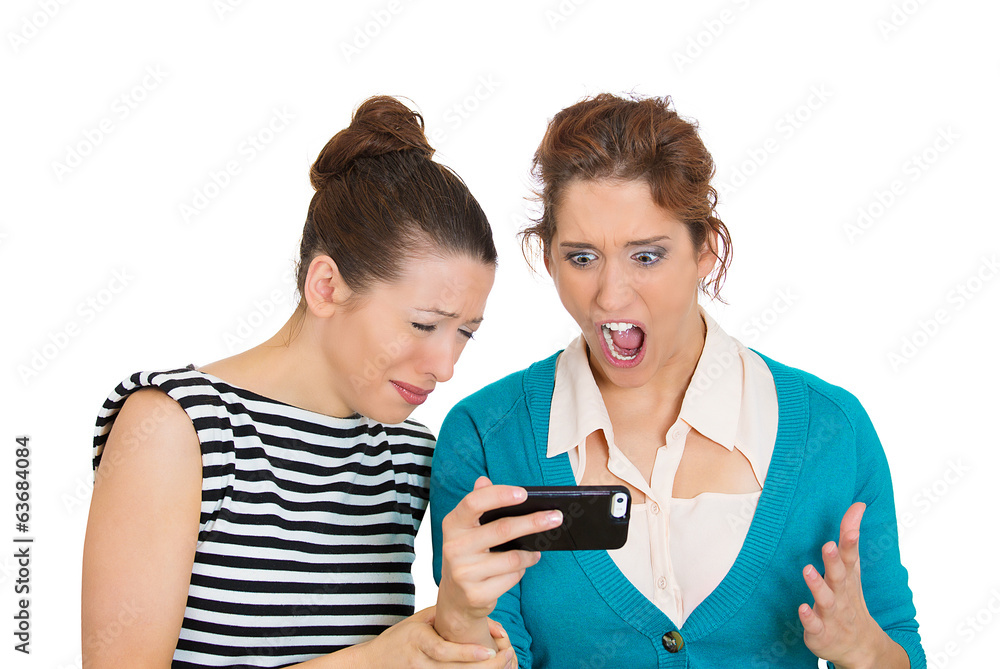 Upset women receiving bad news on mobile cell phone Upset women receiving bad news on mobile cell phone