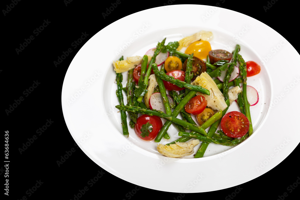 Delicious Fresh salad with asparagus, artichoke and tomatos