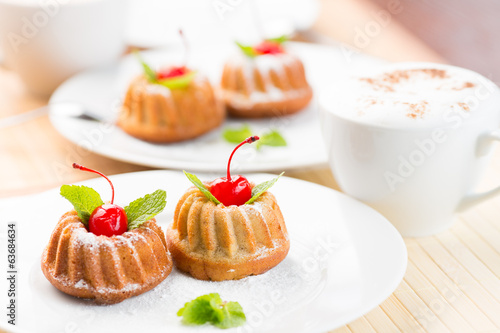 Cakes dessert with cappuccino coffee cup