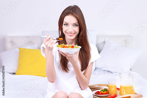Young beautiful woman on be...