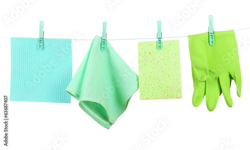 Kitchen sponges and rubber gloves hanging