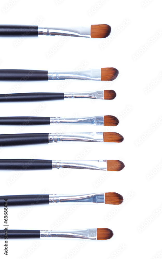 Black make-up brushes isolated on white