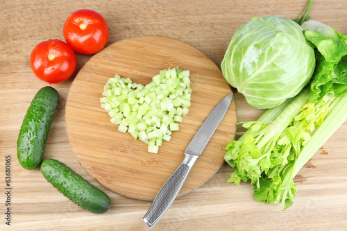 Heart shape of chopped celery  and fresh vegetables,