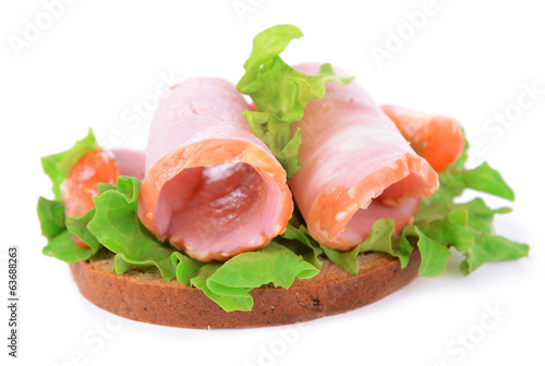 Delicious sandwich with lettuce and ham isolated on white
