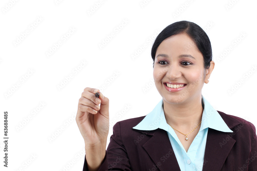 Business woman writing with pen on virtual screen Business woman writing with pen on virtual screen