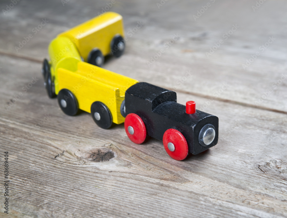 Obraz premium Toy train in wooden background