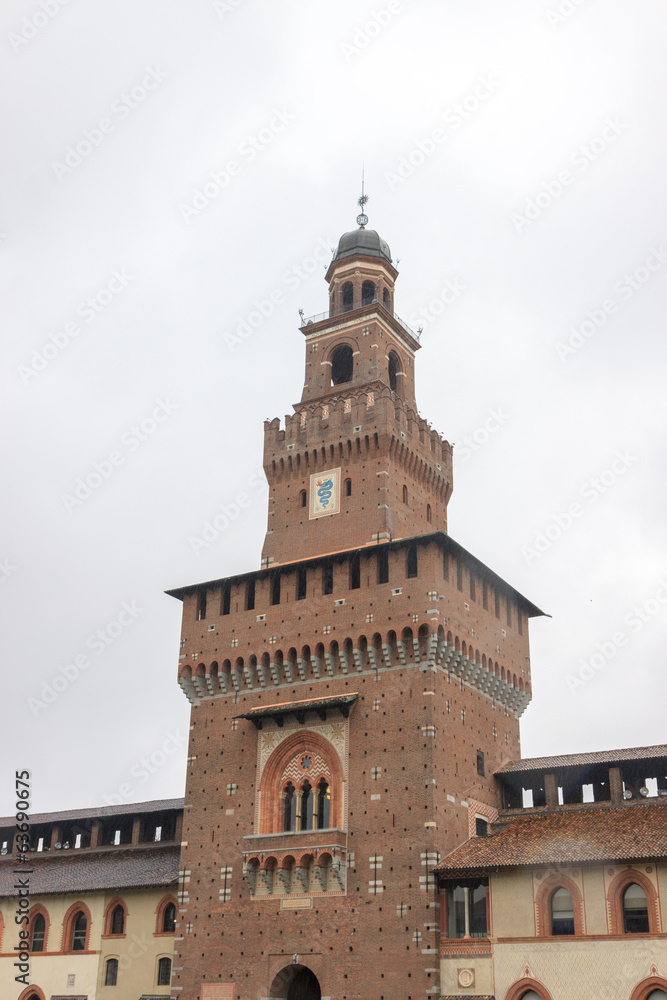 Central tower of Castello Sforzesco under rain
