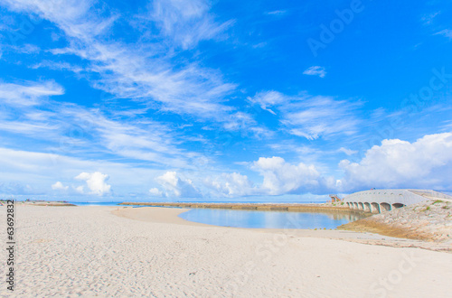 Fototapeta Naklejka Na Ścianę i Meble -  Sandy beach with a bridge in Okinawa