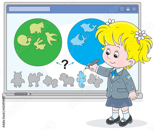 Schoolgirl works with an interactive whiteboard