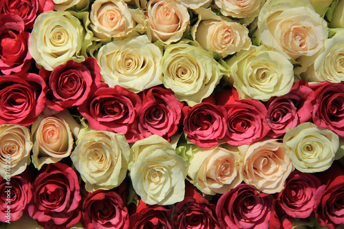 Pink roses in different shades in wedding arrangement