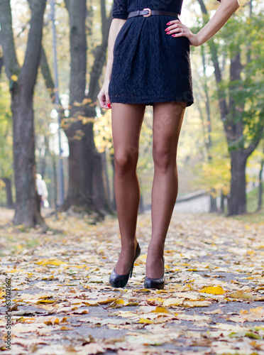 Hot young woman in autumn park