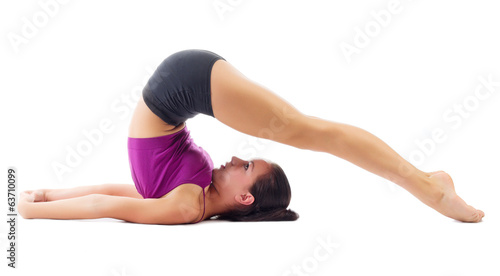 Sporty girl doing gymnastic exercises