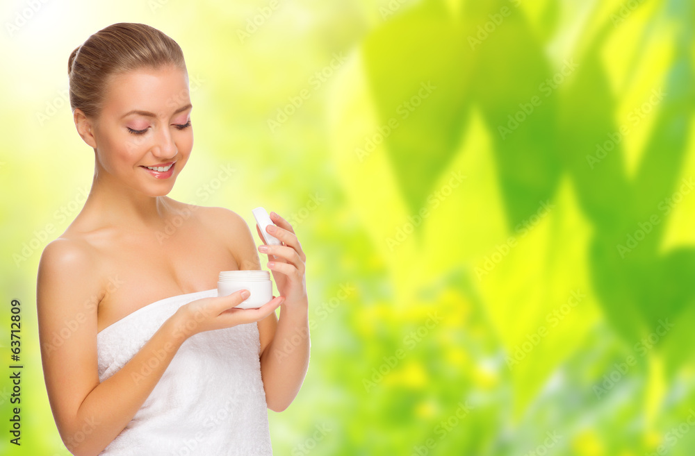 Healthy woman with bady cream on spring background Healthy woman with bady cream on spring background