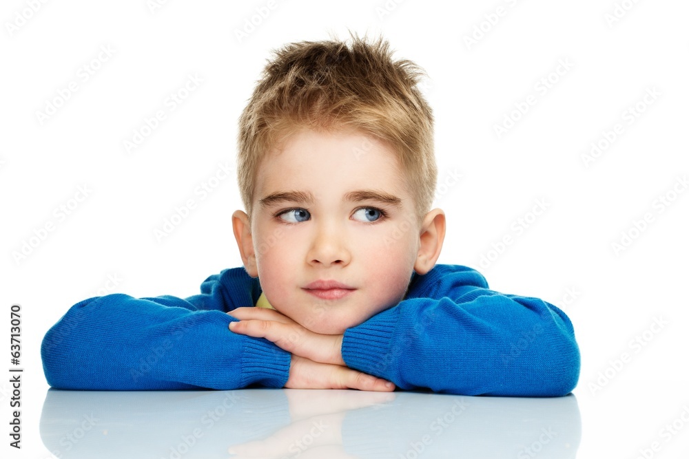 Dreaming little boy in blue cardigan and yellow shirt Dreaming little boy in blue cardigan and yellow shirt