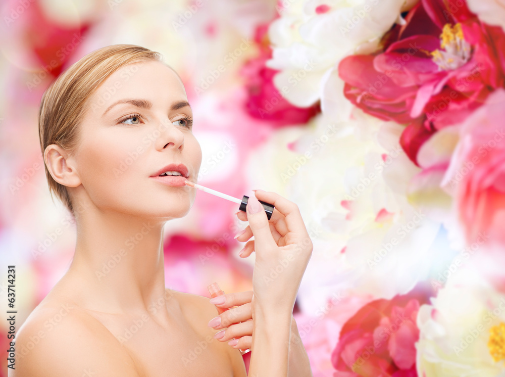 Fototapeta premium beautiful woman with lipgloss