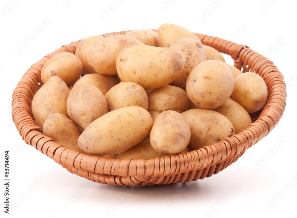 Potato tuber in wicker basket isolated on white background Potato tuber in wicker basket isolated on white background