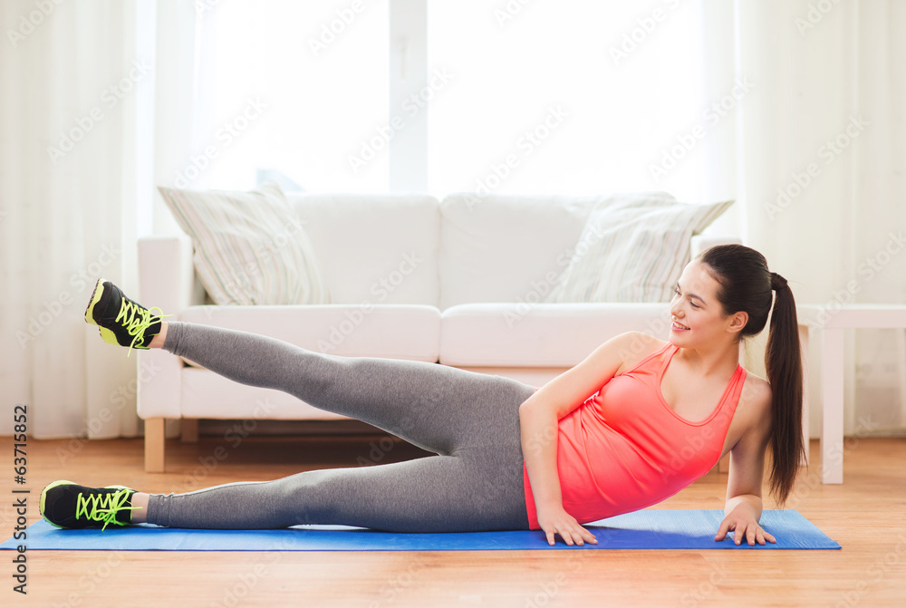 smiling teenage girl doing exercise for legs smiling teenage girl doing exercise for legs