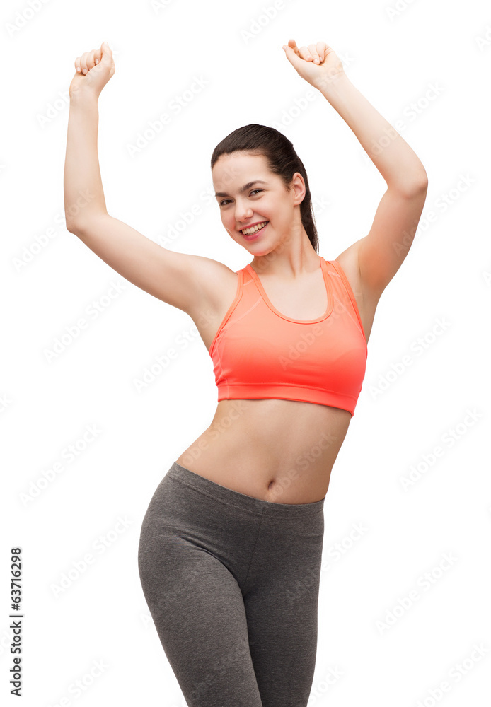smiling teenage girl in sportswear dancing smiling teenage girl in sportswear dancing