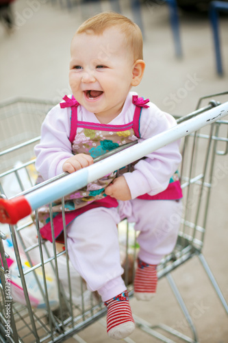 Beautiful baby in shopping cart - trolley