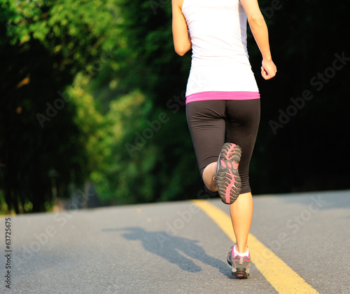 Runner athlete running on road