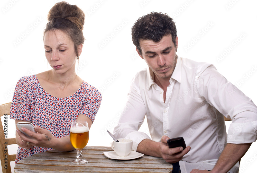 young couple with their phones are Disgruntled young couple with their phones are Disgruntled