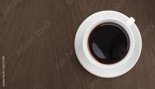 black coffee on wooden table top view
