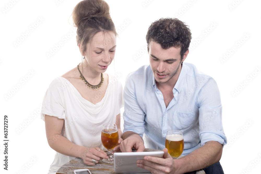 young couple playing with a digital tablet