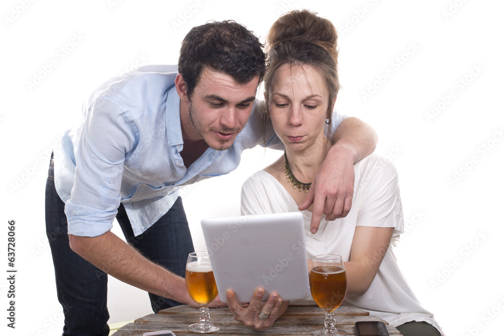 young couple playing with a digital tablet young couple playing with a digital tablet