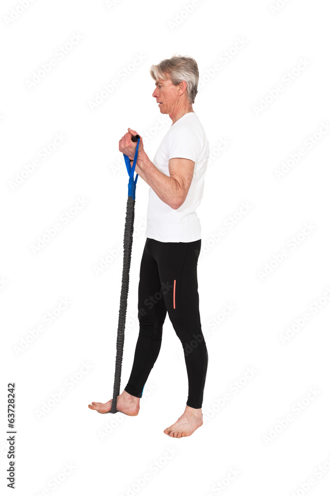 Senior fitness man exercising with blue elastics. Isolated on wh