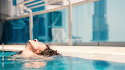 Photography Young woman portrait wearing bikini sunbathing in swimming pool