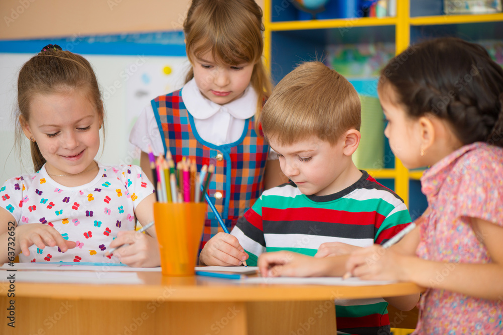 Two cute little girls drawing at school Two cute little girls drawing at school