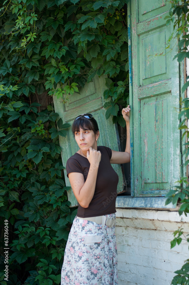 Fototapeta premium Young beautiful girl on a walk in the country