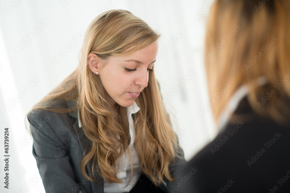 Young cheerful business woman with client Young cheerful business woman with client