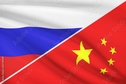 Series of ruffled flags. Russia and China.