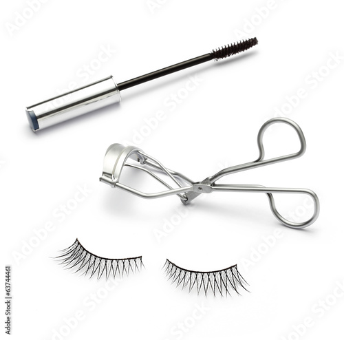 Fototapeta fake false eyelash with eyelash curler and mascara on white