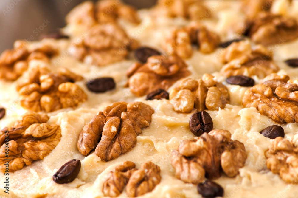 close up view of cake with walnuts and coffee beans close up view of cake with walnuts and coffee beans