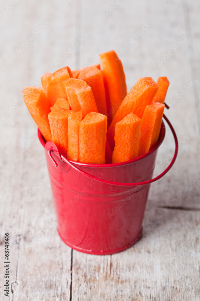 fresh sliced carrot in red bucket