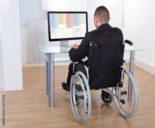 Businessman On Wheelchair Using Computer © Andrey Popov