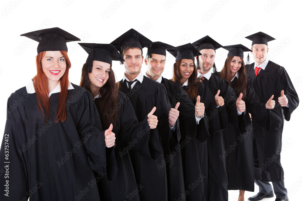 Graduate students standing in row showing thumbs up Graduate students standing in row showing thumbs up