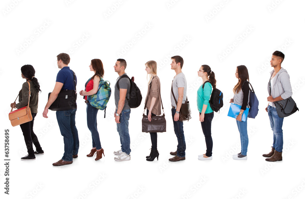 Multiethnic College Students Standing In A Row Multiethnic College Students Standing In A Row