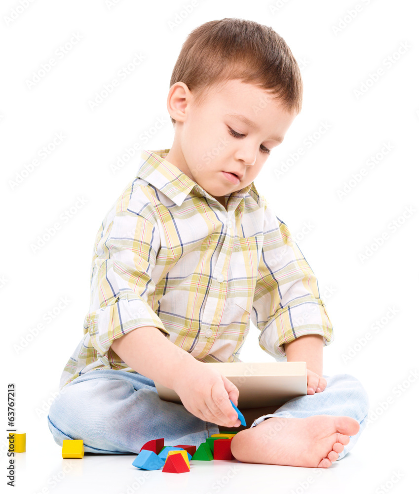 Little boy is playing with toys Little boy is playing with toys