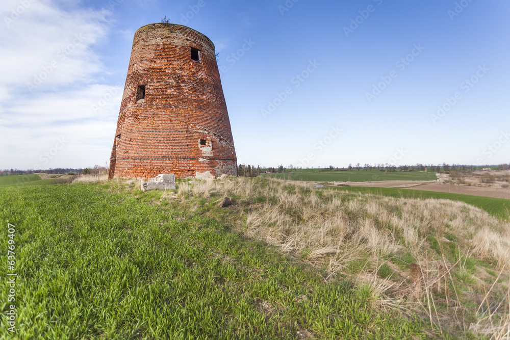 The brick tower destroyed of a windmill The brick tower destroyed of a windmill