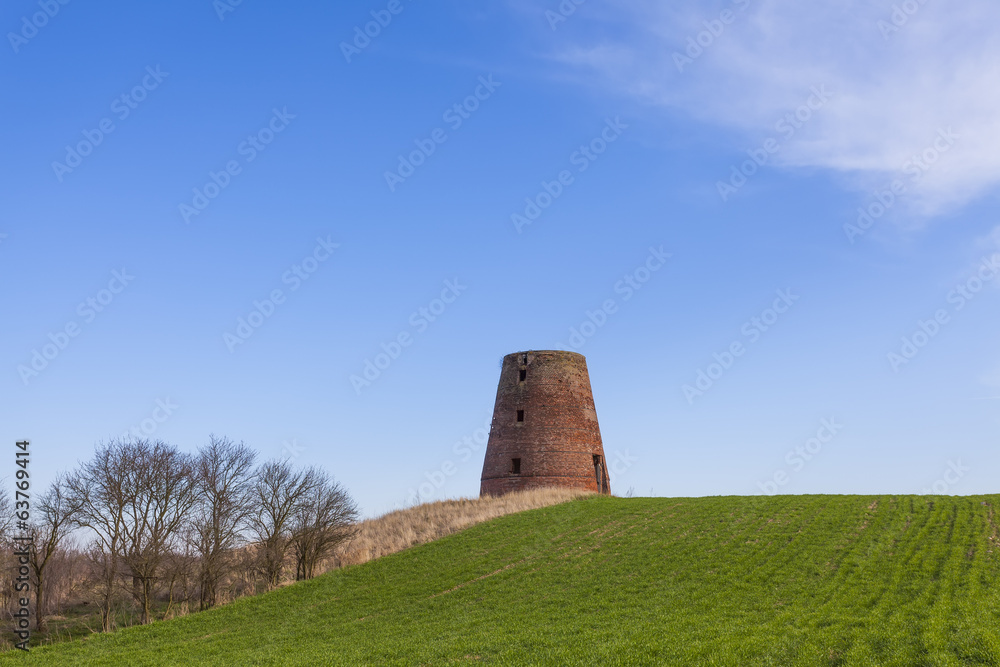 The brick tower destroyed of a windmill
