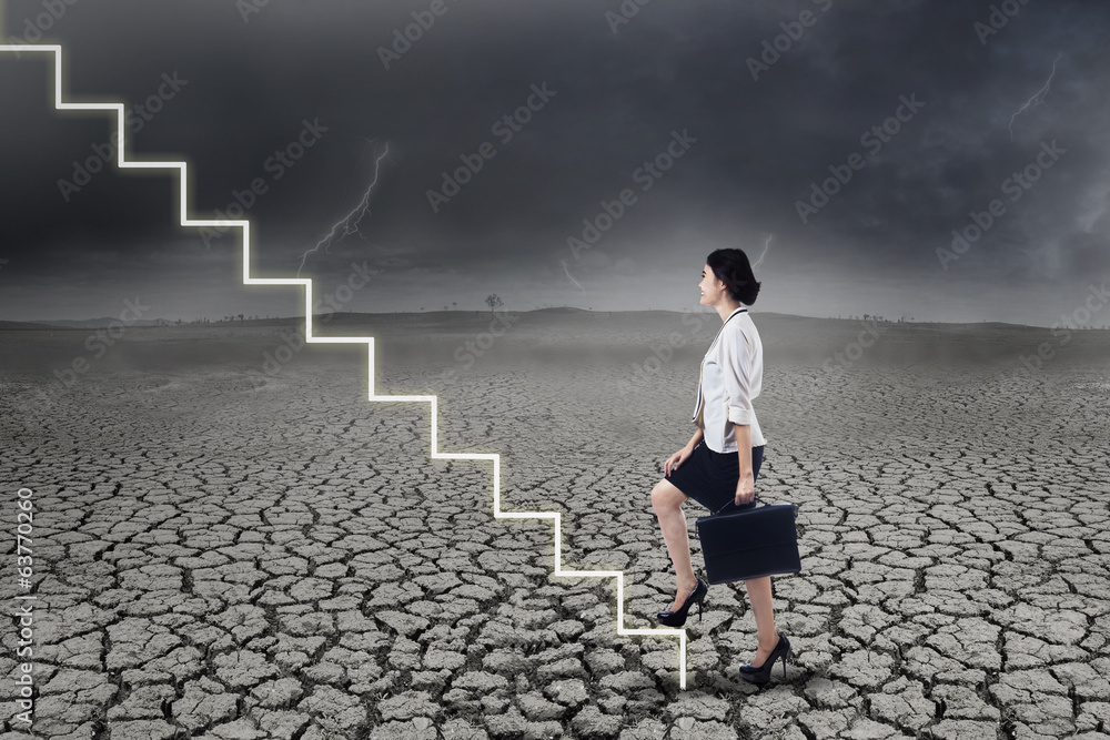 Businesswoman walking up on stairs Businesswoman walking up on stairs
