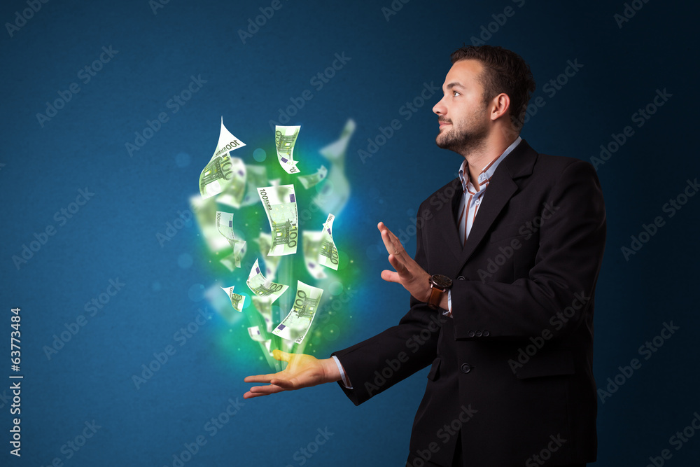 Glowing money in the hand of a businessman Glowing money in the hand of a businessman