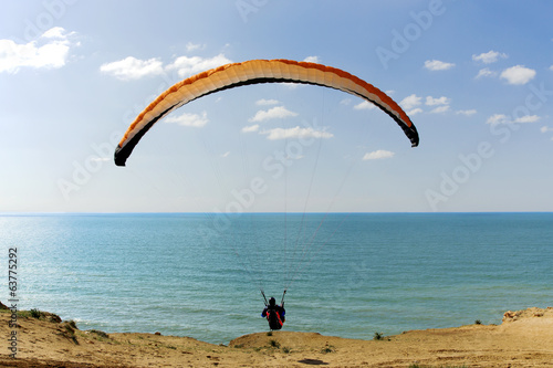 Paraglider flying above Mediterranean, Israel