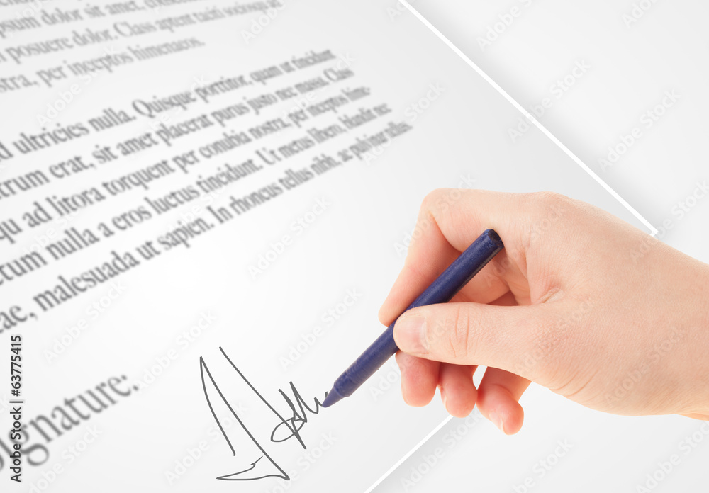 Hand writing personal signature on a paper form Hand writing personal signature on a paper form