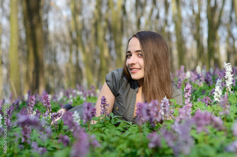 Beautiful young sexy girl on a sunny day in spring forest among Beautiful young sexy girl on a sunny day in spring forest among