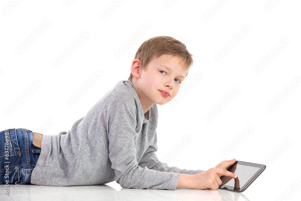 Boy posing with a tablet. Boy posing with a tablet.