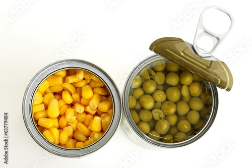 green peas and corn in a can on a white background